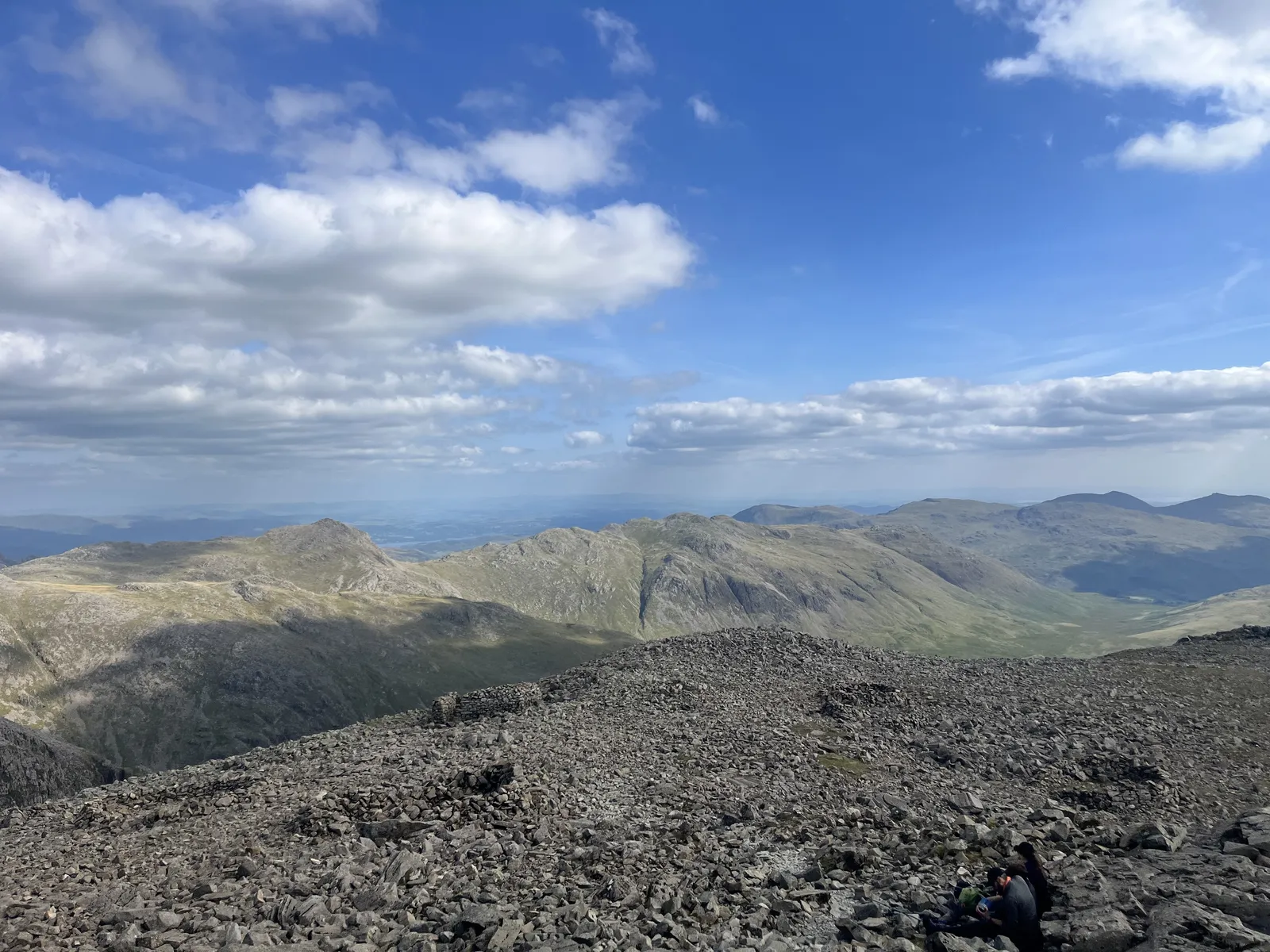 The view from the top of Scafell Pike, a hot and clear afternoon over the Lake District.